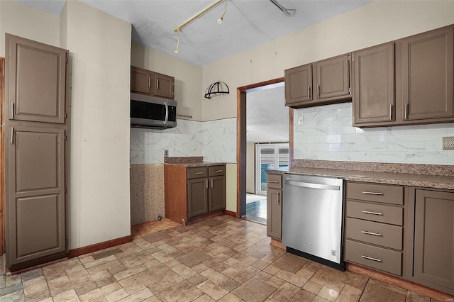 kitchen with tasteful backsplash and stainless steel appliances