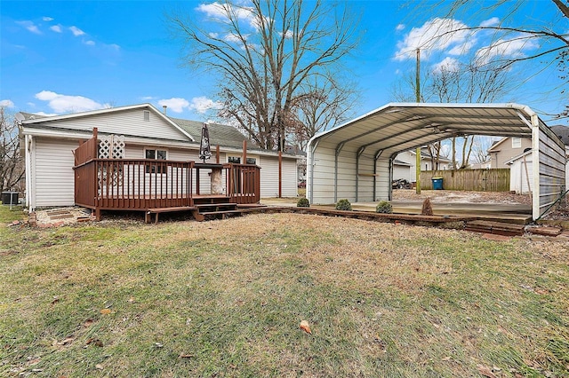 exterior space featuring a yard, a carport, and a deck