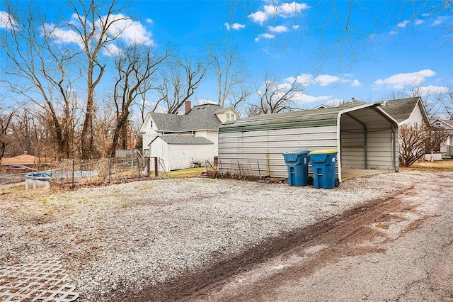 view of property exterior featuring a carport