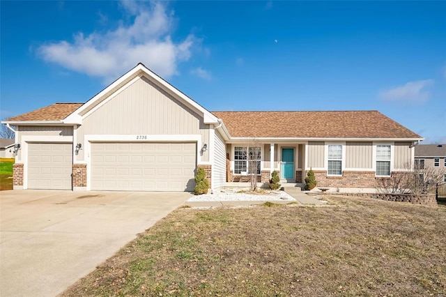 ranch-style home with a garage, driveway, a front lawn, and brick siding