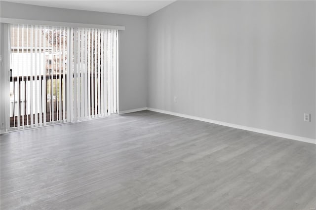 spare room with hardwood / wood-style flooring