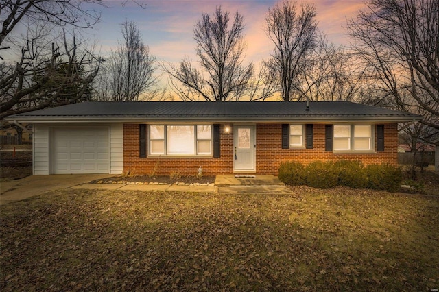 single story home featuring a garage