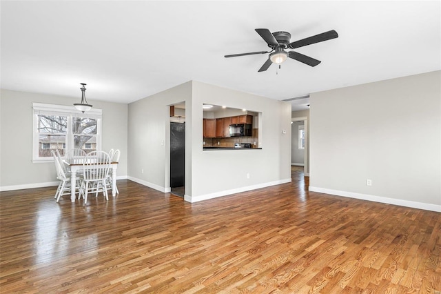 unfurnished living room with light hardwood / wood-style floors and ceiling fan