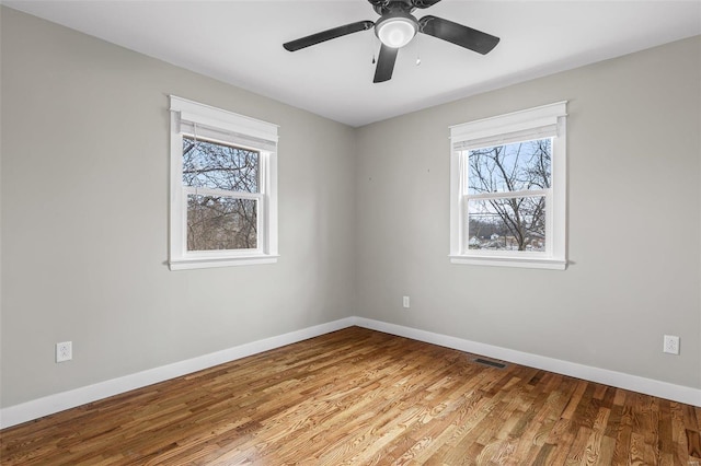 unfurnished room featuring ceiling fan and light wood-type flooring