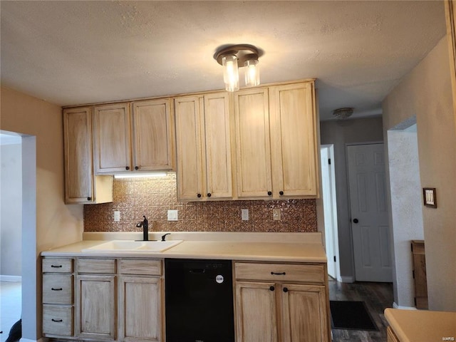 kitchen featuring tasteful backsplash, dishwasher, sink, and light brown cabinets