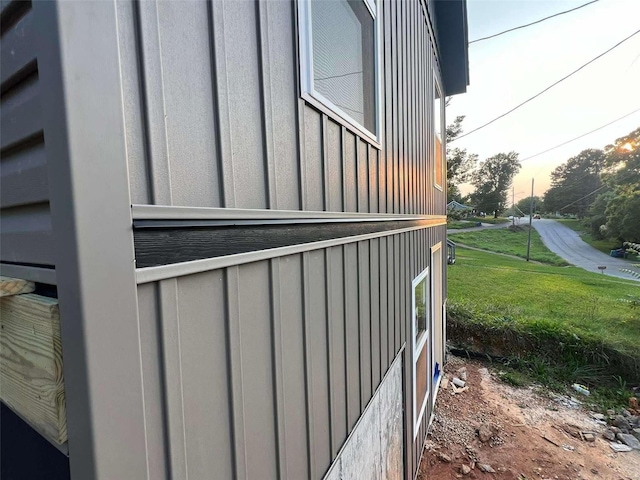 property exterior at dusk with a yard