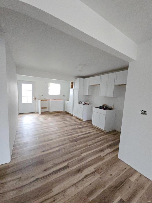 unfurnished living room with light hardwood / wood-style floors