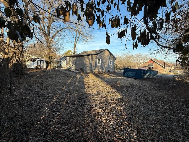 view of side of property with an outbuilding