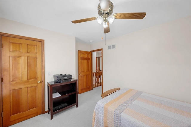 carpeted bedroom with ceiling fan