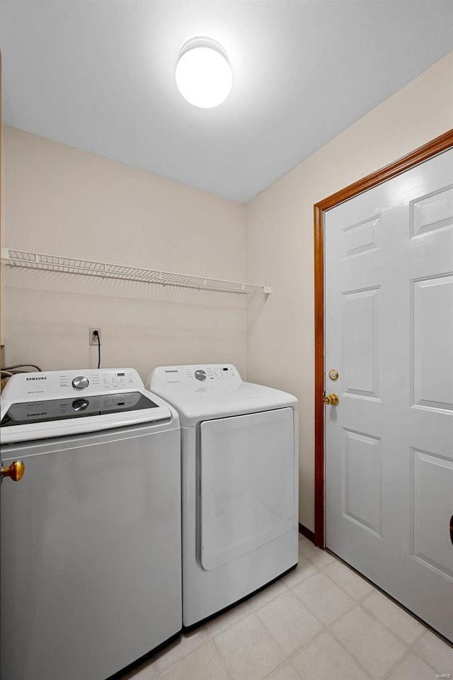 laundry room with washer and clothes dryer