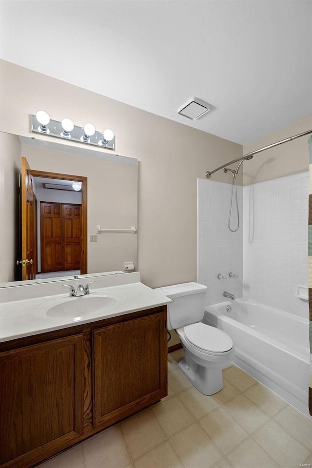 full bathroom featuring tiled shower / bath combo, vanity, and toilet