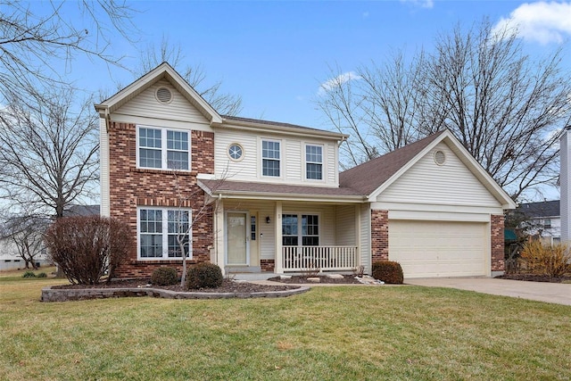 view of front of house featuring a garage, a front lawn, and covered porch