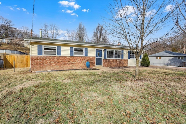 ranch-style home with a front yard