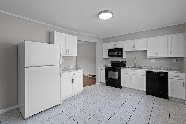 kitchen featuring sink, crown molding, light tile patterned floors, black appliances, and white cabinets