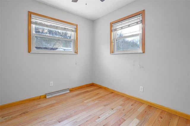 unfurnished room with ceiling fan and light hardwood / wood-style floors