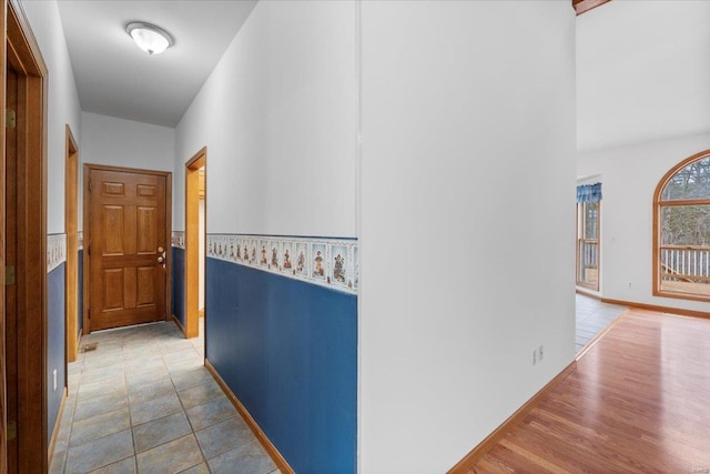 hallway with light hardwood / wood-style flooring