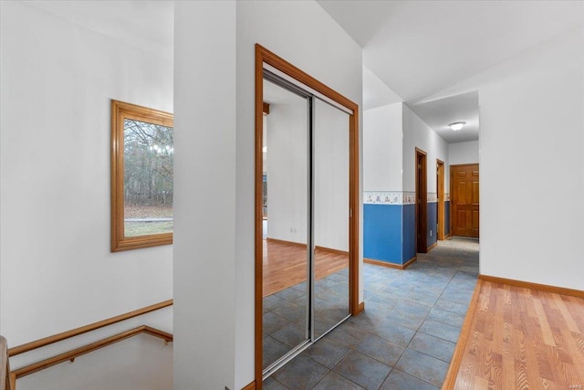 corridor featuring dark hardwood / wood-style floors