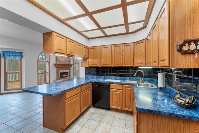 kitchen with light tile patterned flooring, sink, dishwasher, kitchen peninsula, and decorative backsplash