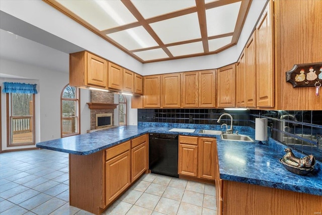 kitchen featuring sink, light tile patterned floors, dishwasher, decorative backsplash, and kitchen peninsula