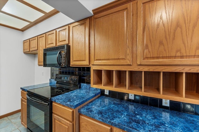 kitchen with backsplash and black appliances