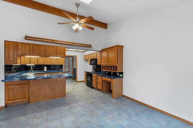 kitchen with tasteful backsplash, ceiling fan, kitchen peninsula, a towering ceiling, and black appliances