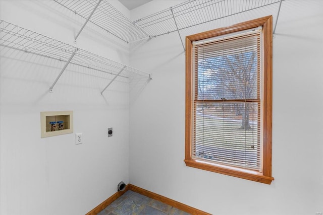 washroom featuring hookup for an electric dryer, hookup for a washing machine, and a wealth of natural light