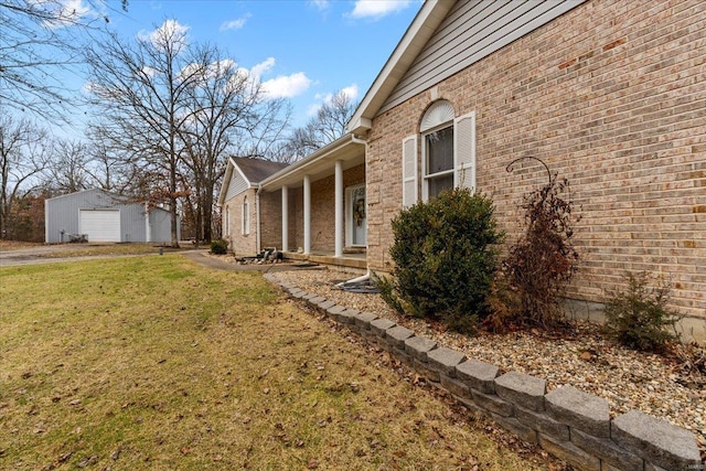 view of home's exterior featuring an outbuilding, a yard, and a garage