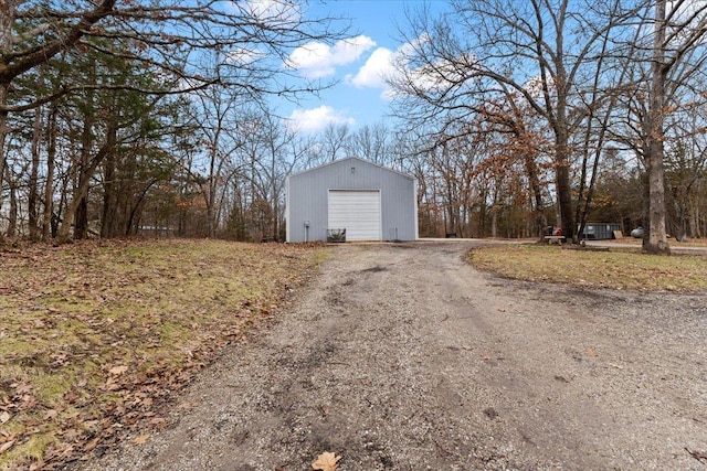 exterior space with an outbuilding and a garage