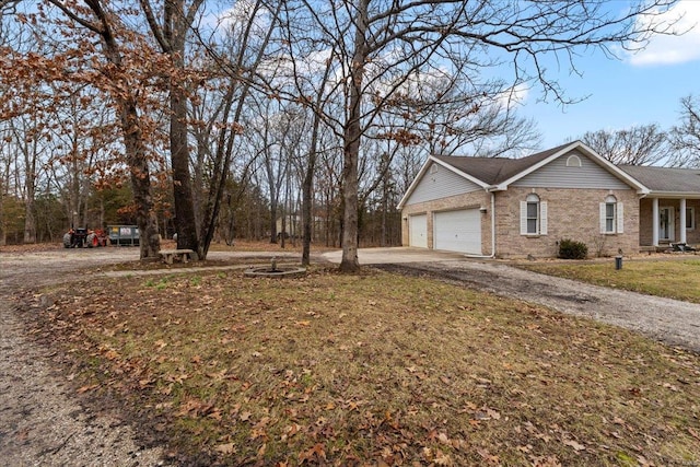 view of home's exterior featuring a garage and a lawn