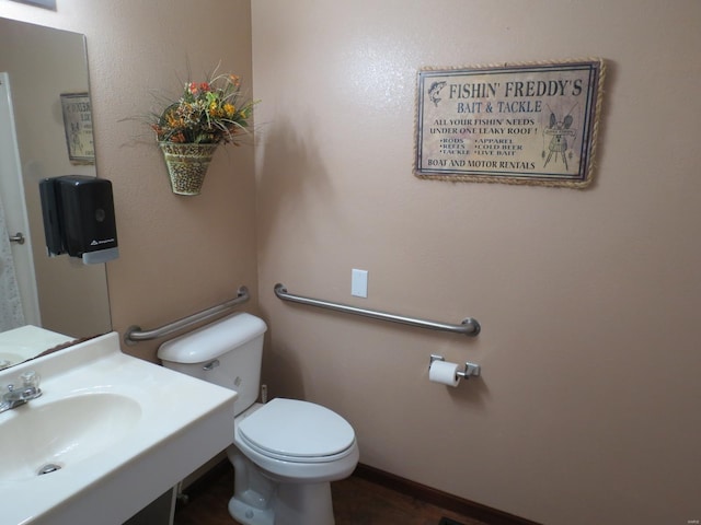 bathroom with sink and toilet