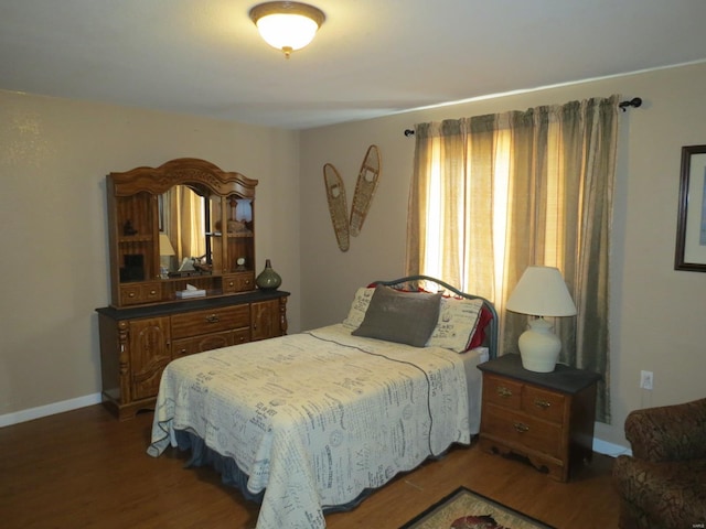 bedroom featuring dark hardwood / wood-style flooring