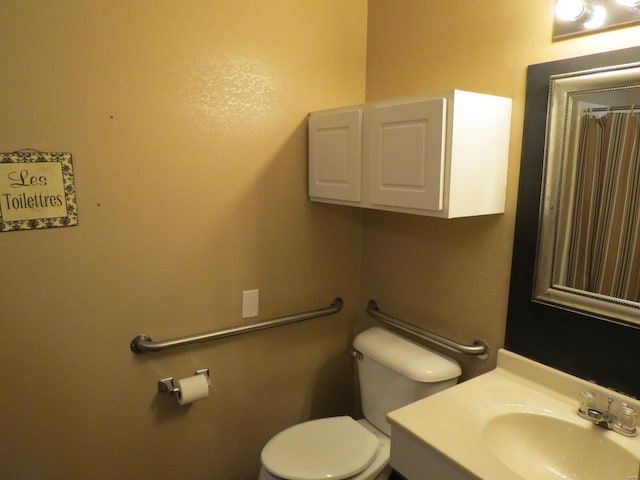 bathroom with toilet and sink