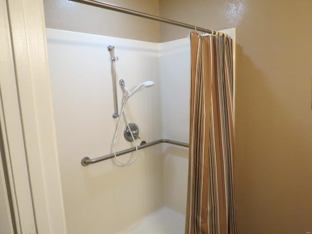 bathroom with a shower with shower curtain