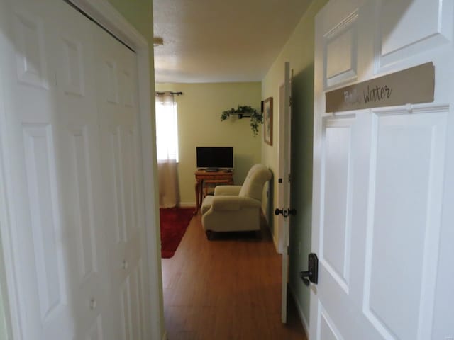 hallway with wood-type flooring