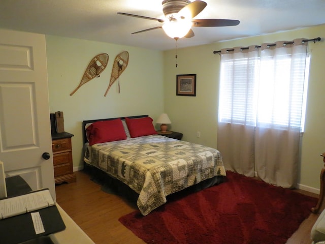 bedroom with hardwood / wood-style floors and ceiling fan