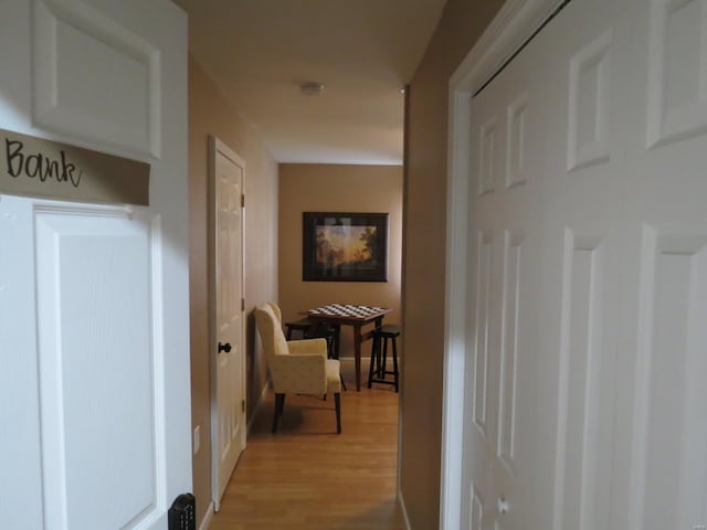 corridor featuring light hardwood / wood-style floors