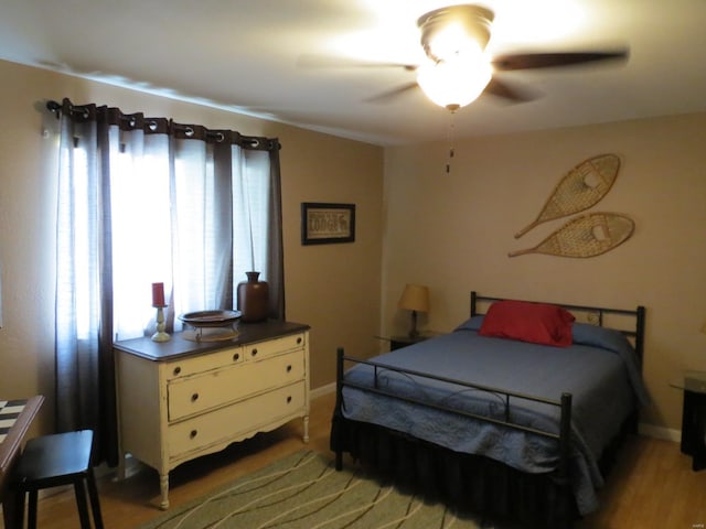 bedroom featuring ceiling fan and hardwood / wood-style floors