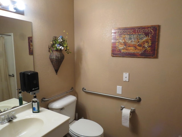 bathroom with sink and toilet