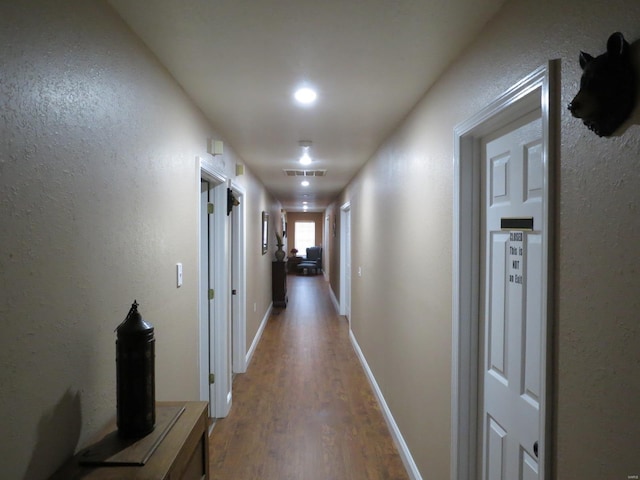 hall featuring wood-type flooring