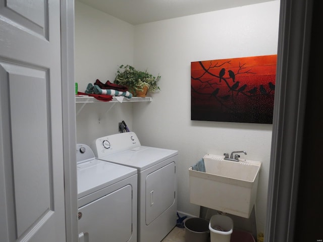 laundry room with sink and washer and clothes dryer