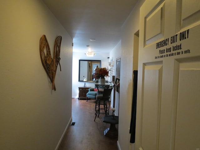 hallway with dark wood-type flooring