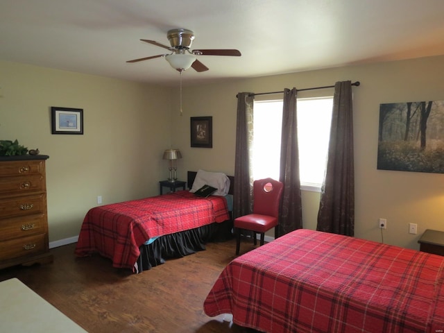 bedroom featuring ceiling fan and dark hardwood / wood-style flooring