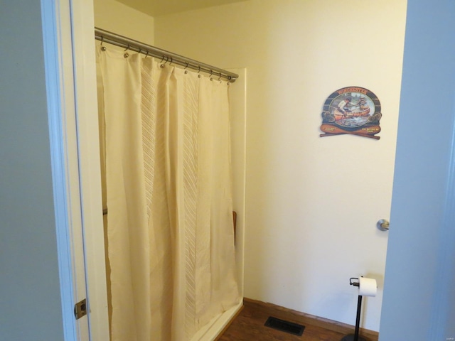 bathroom featuring hardwood / wood-style flooring