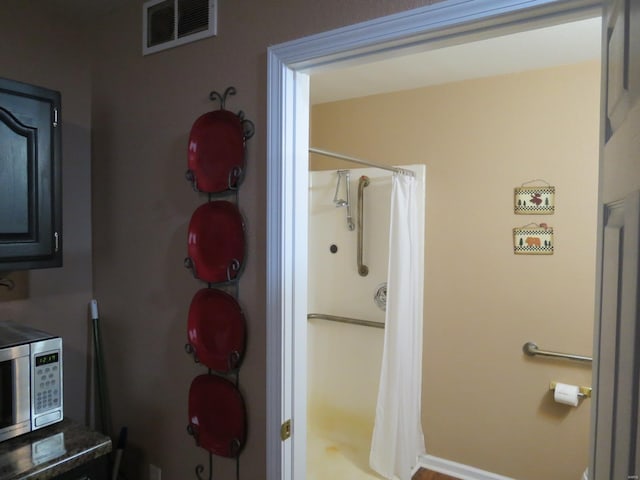 bathroom with a shower with shower curtain