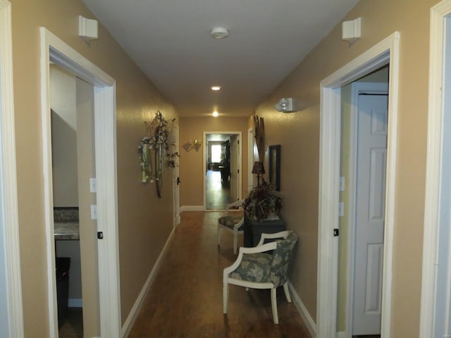 corridor with dark wood-type flooring