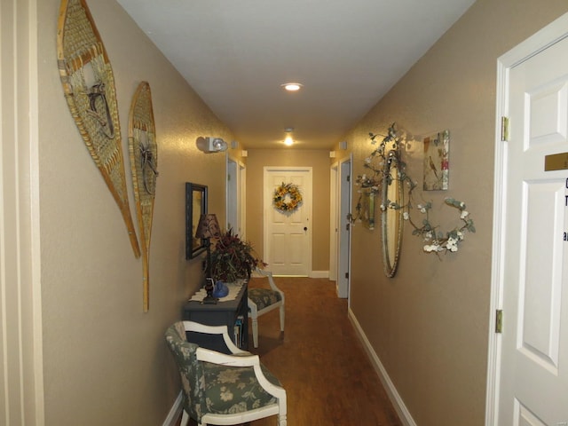 corridor with hardwood / wood-style flooring