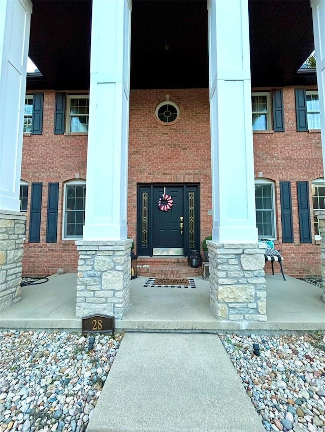 doorway to property with a porch