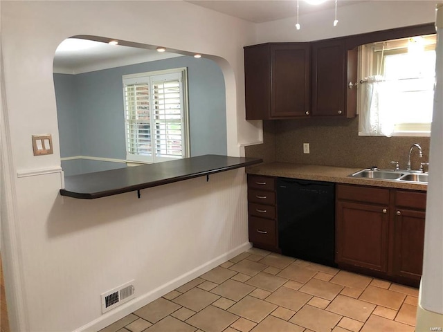 kitchen with dark brown cabinetry, dishwasher, sink, and decorative backsplash