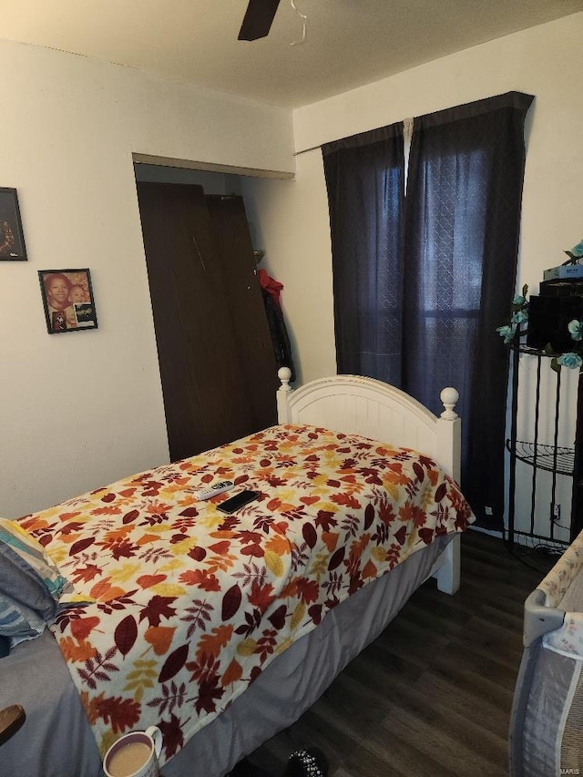 bedroom featuring ceiling fan and dark hardwood / wood-style flooring