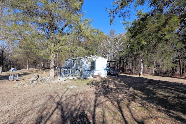 view of yard featuring a deck